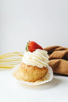 Vanilla Cupcakes topped with Vanilla Mascarpone